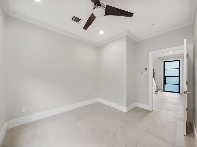 a view of an empty room and window