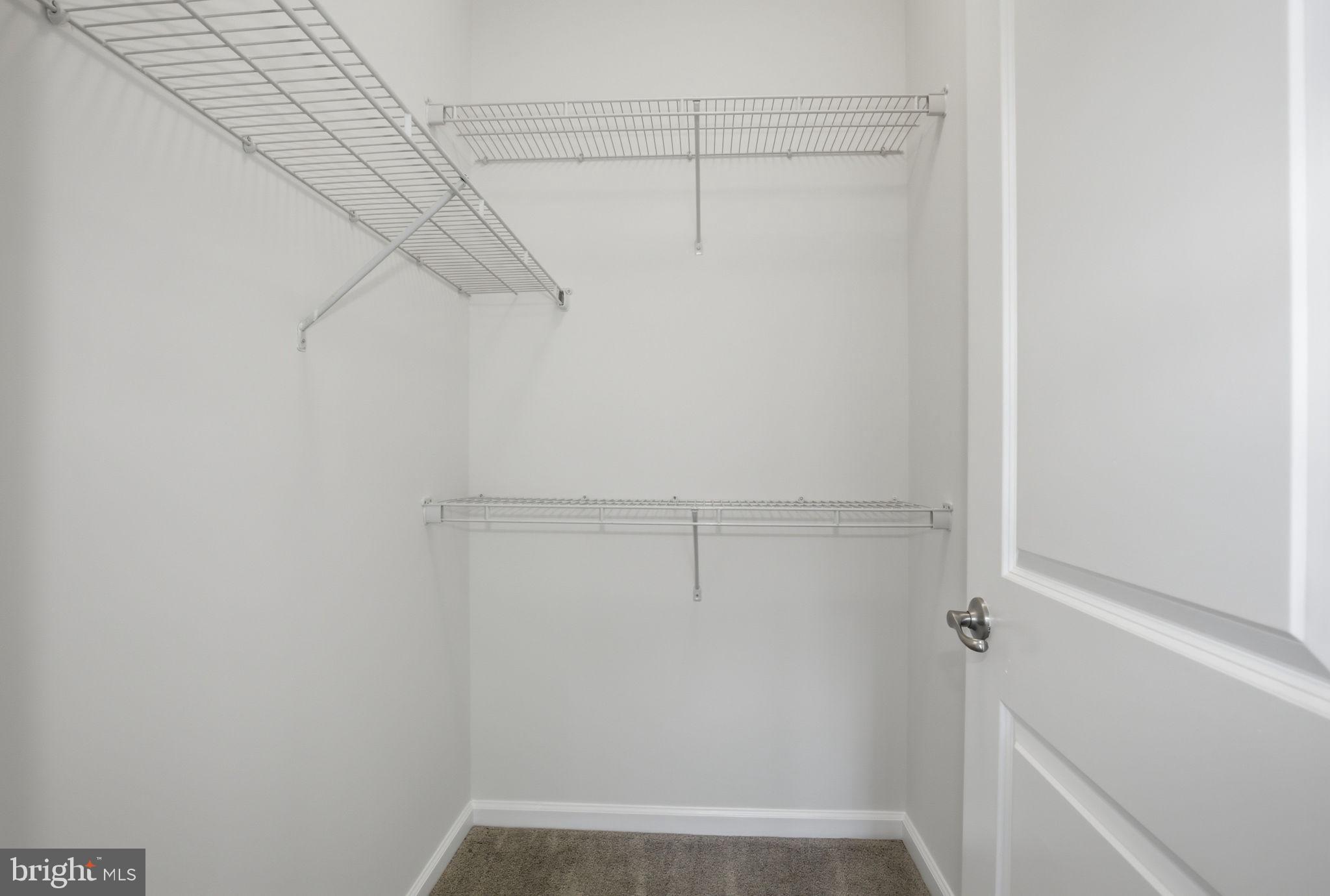 2784 Fredericksburg Road Hanover, MD 21076 - Photo 40 of 60 a view of walk in closet with empty racks