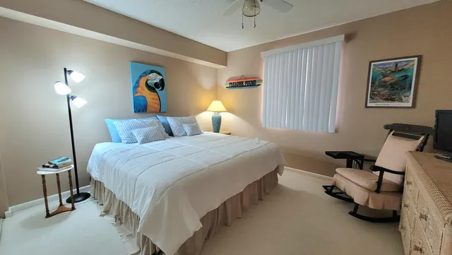 a bedroom with bed and a window