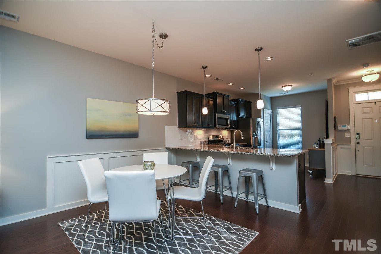 7877 Allscott Way Raleigh, NC 27612 - Photo 8 of 25 Easily fit your larger dining table in this space.