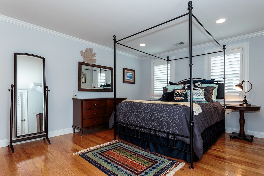 40 Catherine Street, Unit 2 Boston, MA 02131 - Photo 17 of 26 a bedroom with a bed and a mirror on the dresser