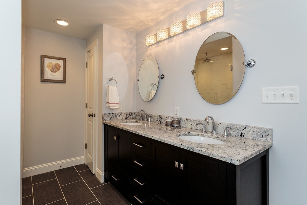 40 Catherine Street, Unit 2 Boston, MA 02131 - Photo 18 of 26 a bathroom with a double vanity sink and a mirror