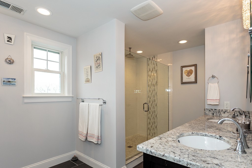 40 Catherine Street, Unit 2 Boston, MA 02131 - Photo 19 of 26 a bathroom with a granite countertop sink a shower and a mirror