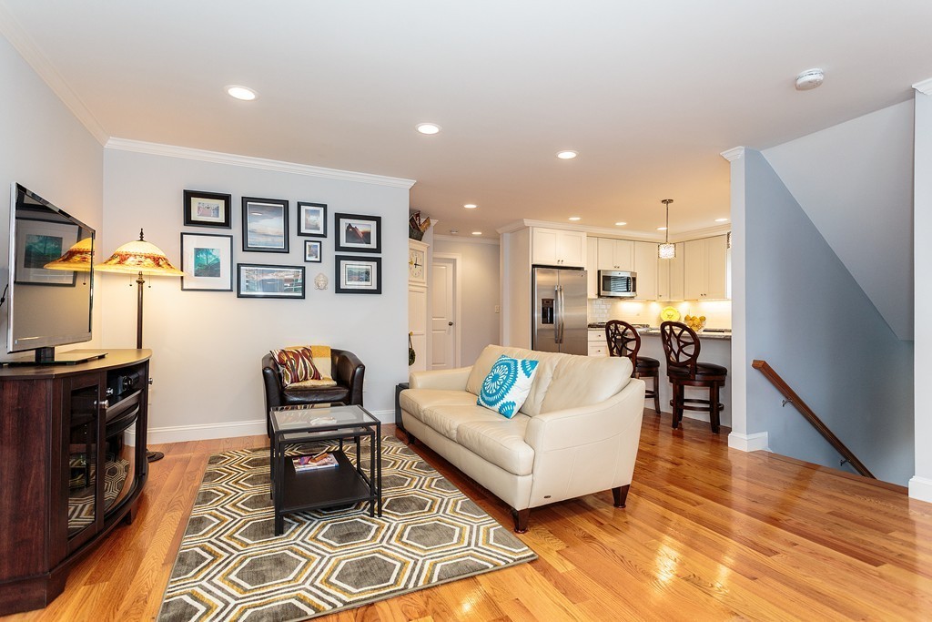 40 Catherine Street, Unit 2 Boston, MA 02131 - Photo 4 of 26 a living room with furniture and wooden floor