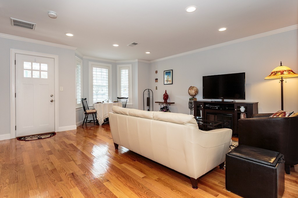40 Catherine Street, Unit 2 Boston, MA 02131 - Photo 6 of 26 a living room with furniture and a flat screen tv