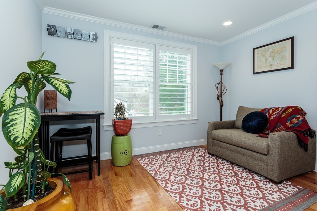40 Catherine Street, Unit 2 Boston, MA 02131 - Photo 8 of 26 a living room with furniture a window and a fireplace
