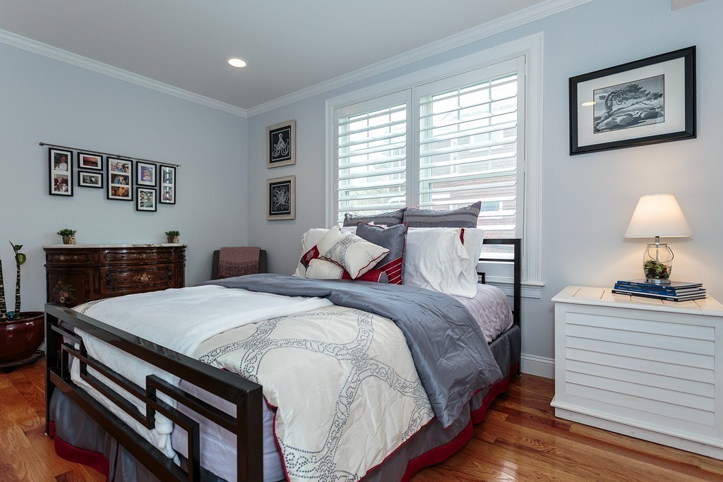 40 Catherine Street, Unit 2 Boston, MA 02131 - Photo 10 of 26 a bedroom with a bed and a desk