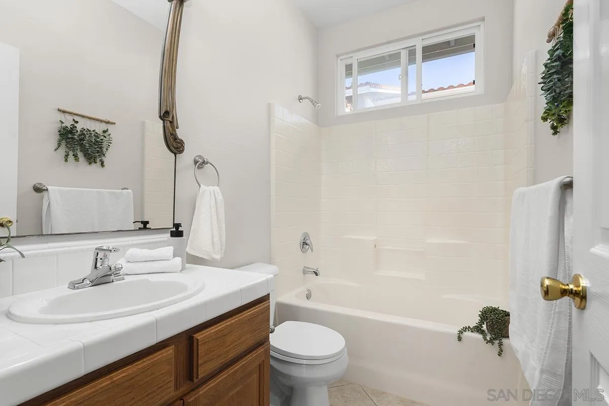 987 Palencia Court Chula Vista, CA 91910 - Photo 45 of 70 a bathroom with a sink toilet and shower