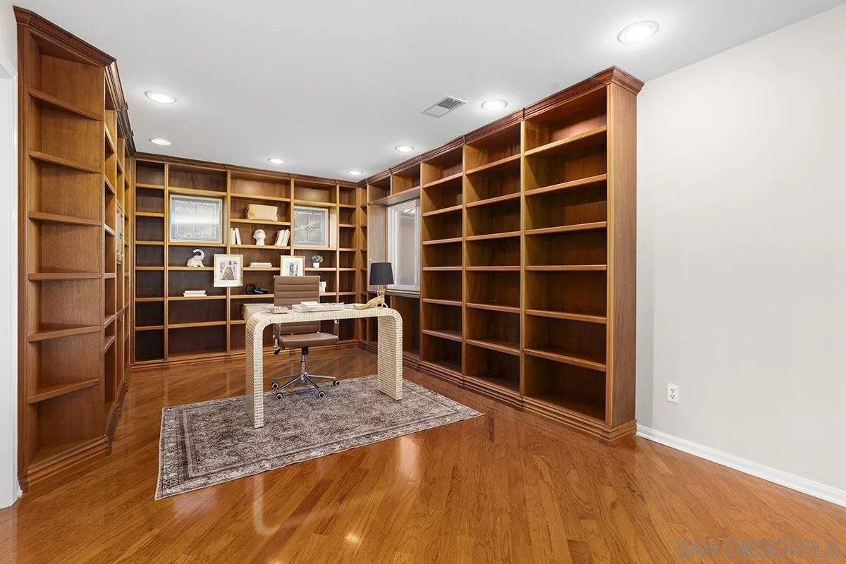 987 Palencia Court Chula Vista, CA 91910 - Photo 50 of 70 a view of room with wooden floor and windows