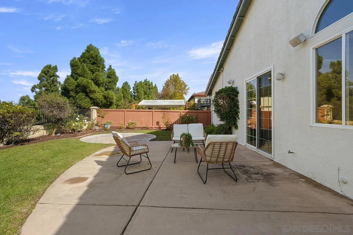 987 Palencia Court Chula Vista, CA 91910 - Photo 57 of 70 a view of a patio with a table and chairs and garden
