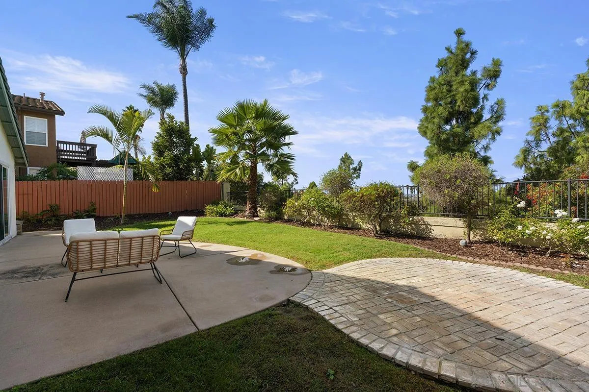 987 Palencia Court Chula Vista, CA 91910 - Photo 60 of 70 a view of a backyard with a garden and entertaining space