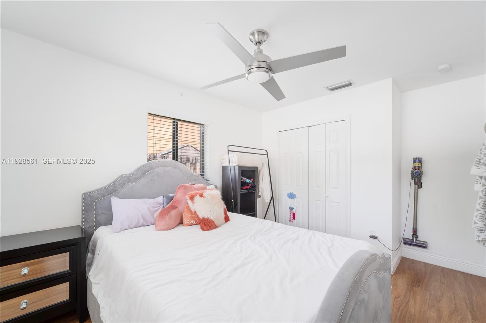 10350 Southwest 4th Street Sweetwater, FL 33174 - Photo 17 of 27 a bedroom with a bed and a window