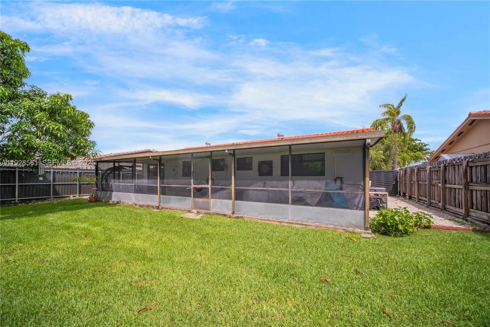 10350 Southwest 4th Street Sweetwater, FL 33174 - Photo 26 of 27 a view of a house with a yard and sitting area