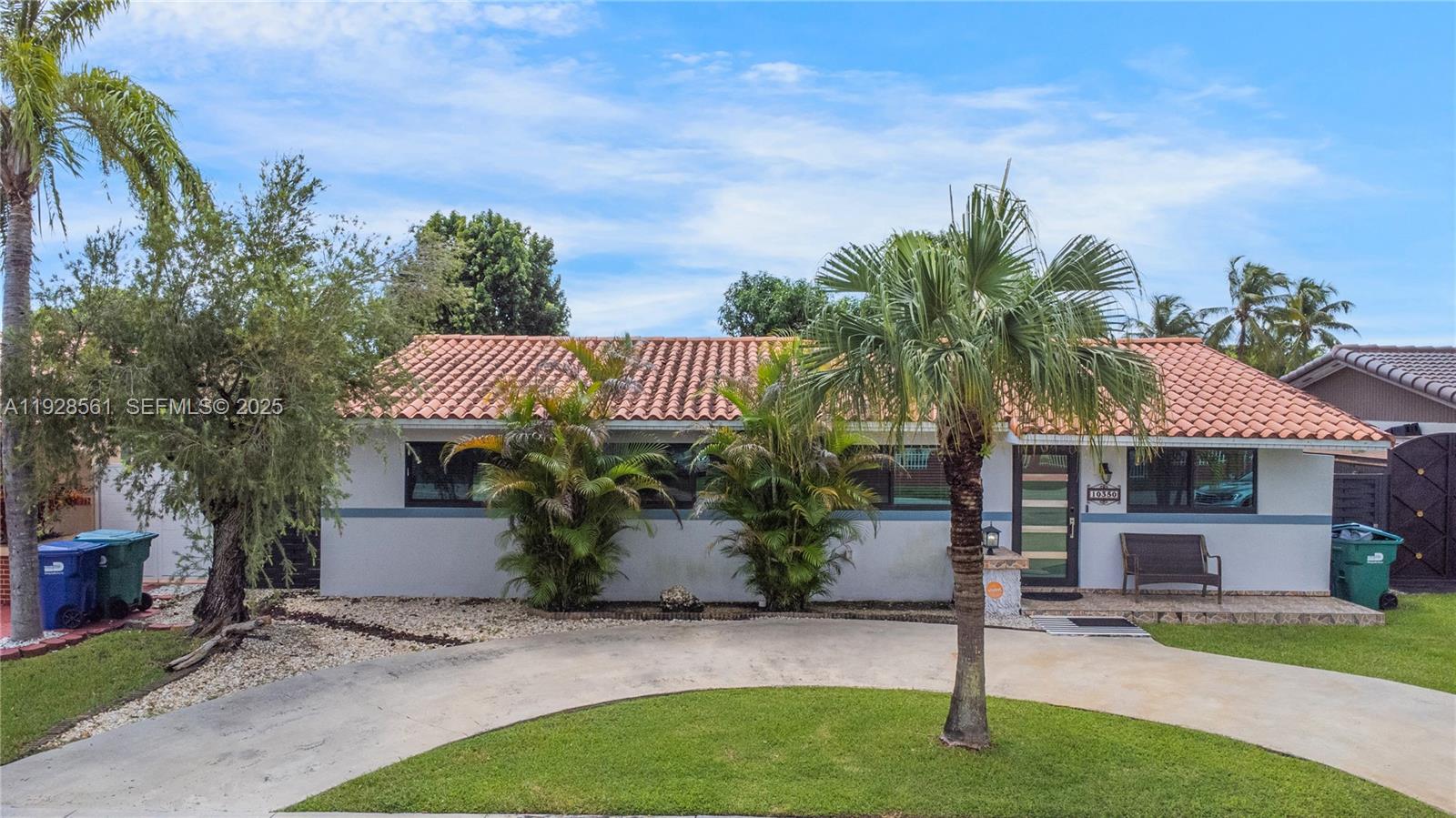 10350 Southwest 4th Street Sweetwater, FL 33174 - Photo 3 of 27 a view of a house with a yard and sitting area