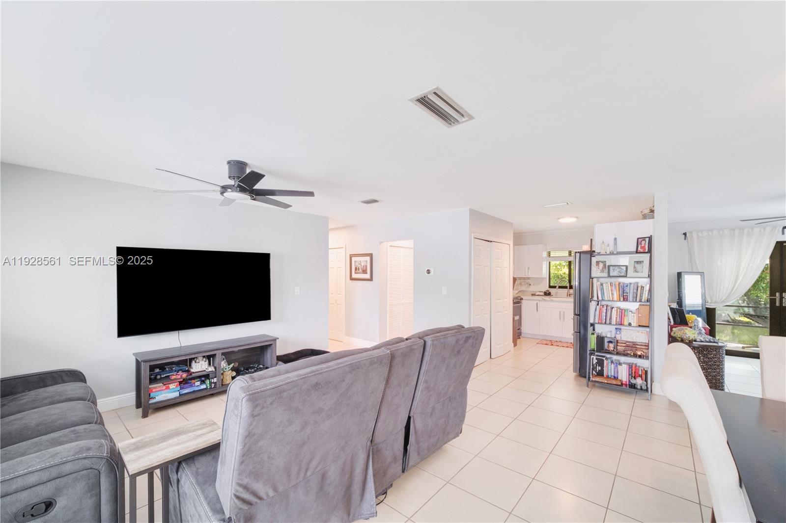 10350 Southwest 4th Street Sweetwater, FL 33174 - Photo 6 of 27 a living room with furniture and a flat screen tv