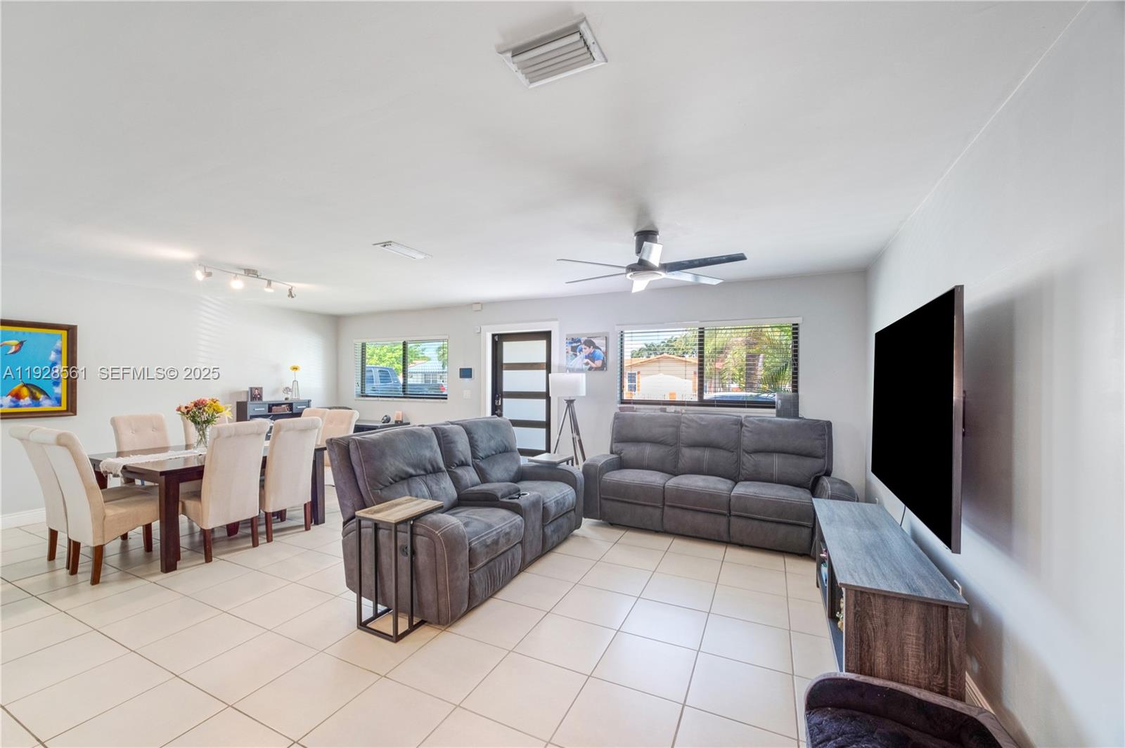 10350 Southwest 4th Street Sweetwater, FL 33174 - Photo 10 of 27 a living room with furniture and a flat screen tv
