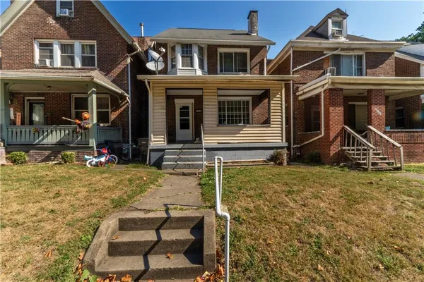 front view of a house with a yard