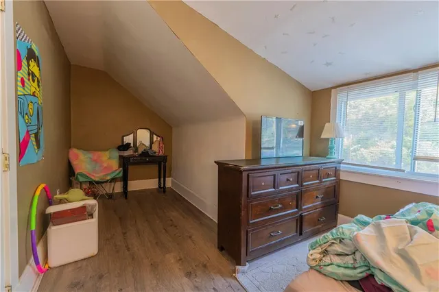 a room with furniture and a wooden floor