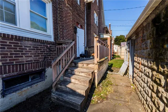 a view of a house with a street