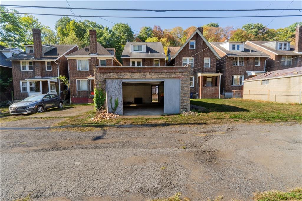 1012 Franklin Avenue Aliquippa, PA 15001 - Photo 21 of 21 a front view of a house with a yard and garage