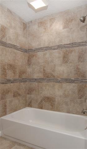 5590 Vanderbilt Road Old Hickory, TN 37138 - Photo 13 of 20 Tile around the tub/shower combos have nice glass inlays, all the hard work has already been done on this home.