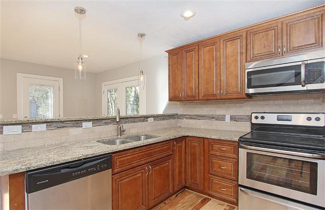 New hardwood floors, new lighting package throughout. Kitchen has pantry and lots of room to move around.