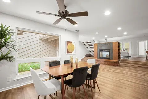 a view of a dining room with furniture and wooden floor