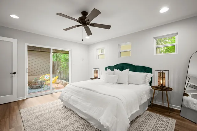 a bedroom with a large bed and a window