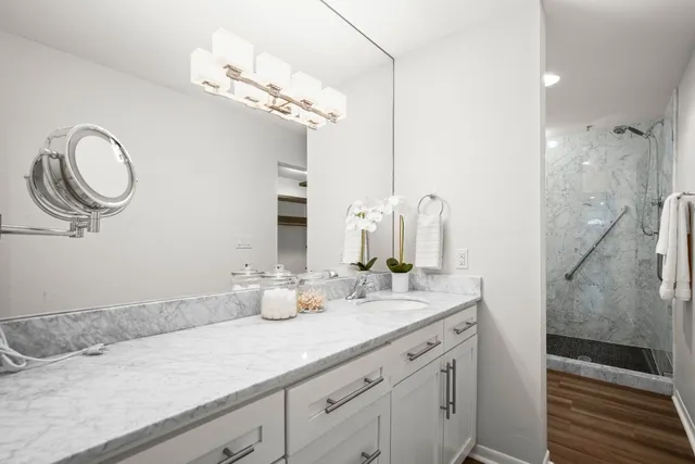 a bathroom with a double vanity sink and a mirror