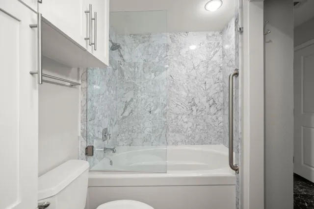 a bathroom with a bathtub and a shower