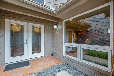 a view of a tree in the middle of a yard