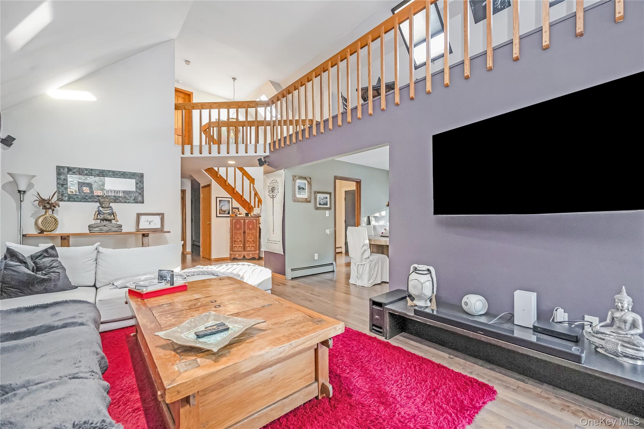 2 Martin Place Northport, NY 11768 - Photo 12 of 24 a living room with furniture flat screen tv and a window
