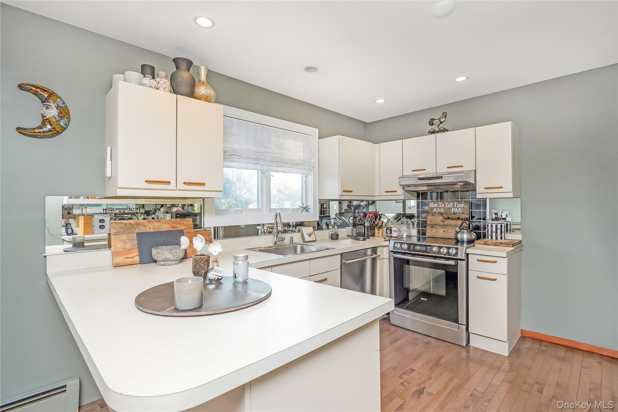 2 Martin Place Northport, NY 11768 - Photo 15 of 24 a kitchen with a sink a stove and cabinets