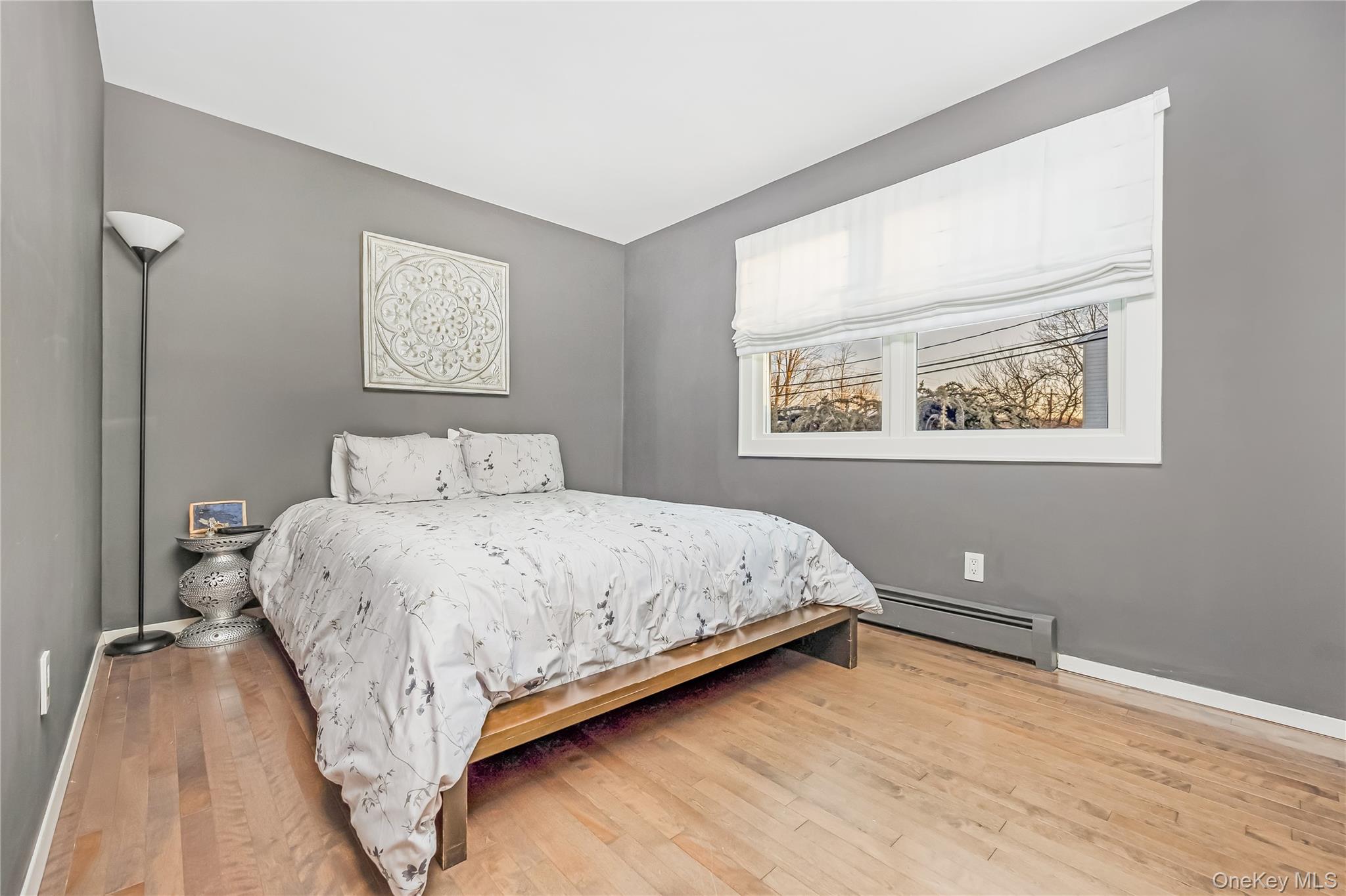 2 Martin Place Northport, NY 11768 - Photo 20 of 24 a bedroom with a bed and a window