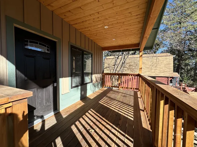 a view of balcony with wooden floor