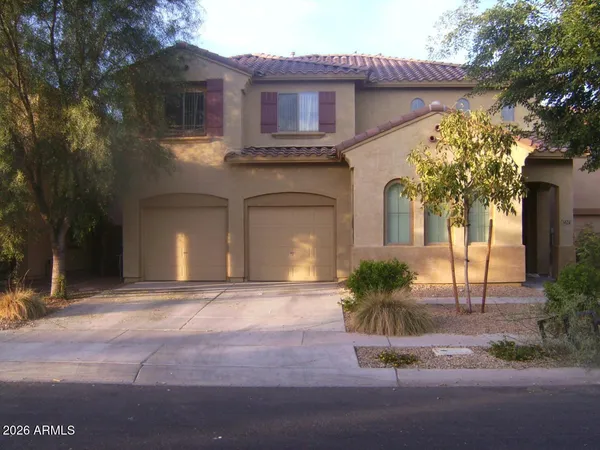 a front view of a house with yard