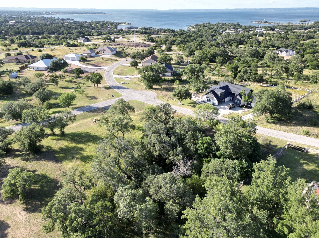 Lot 41 Keystone Ridge Buchanan Dam, TX 78609 - Photo 7 of 10 an aerial view of residential house with parking and trees