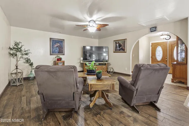 a view of a livingroom with furniture and windows