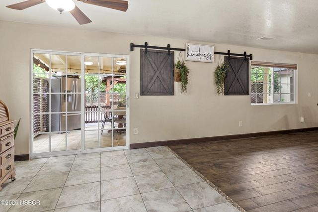 a bed room with a bed and a chandelier