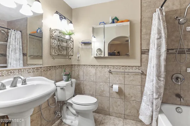 a bed room with a bed and a mirror