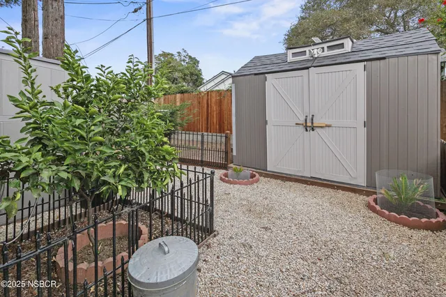 a view of a balcony with wooden floor and fence