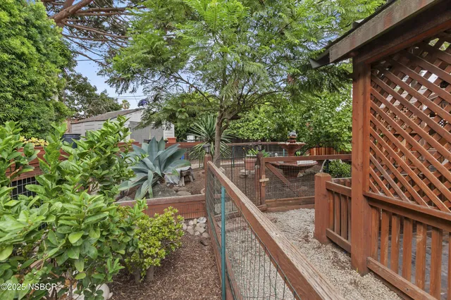 a view of a patio with table and chairs