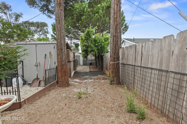 a kitchen with granite countertop stainless steel appliances and wooden cabinets