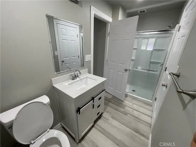 a view of hallway with wooden floor