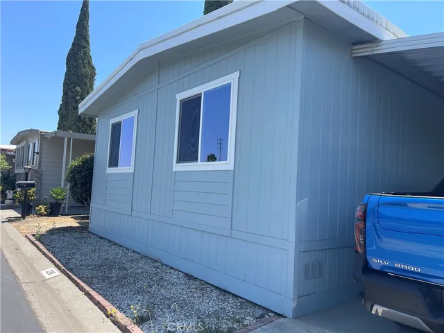 a view of a house with a flower plants