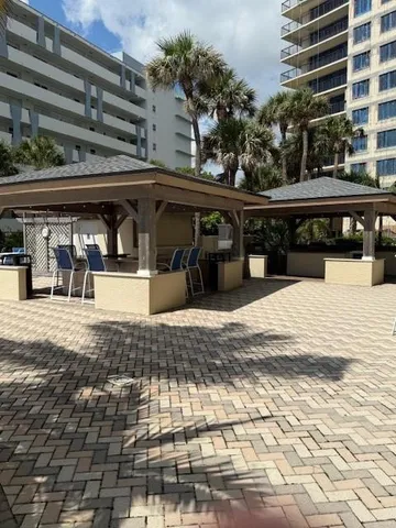 a kitchen with a sink and white cabinets