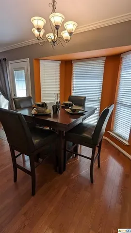 a living room with hard wood flooring