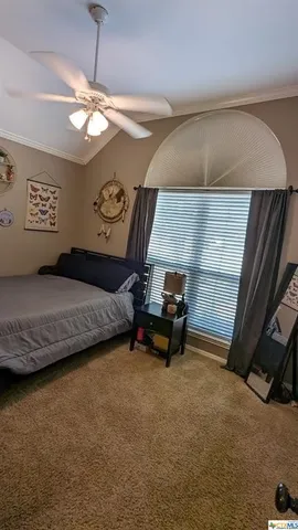 a bathroom with a sink a toilet a mirror and shower