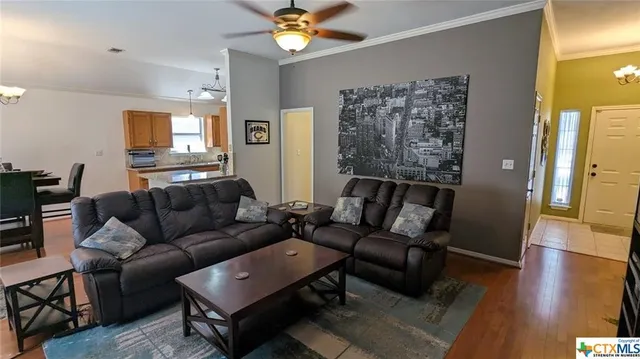 a view of a dining room with furniture and wooden floor