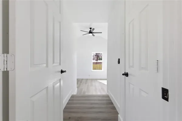 a view of a hallway with a white walls